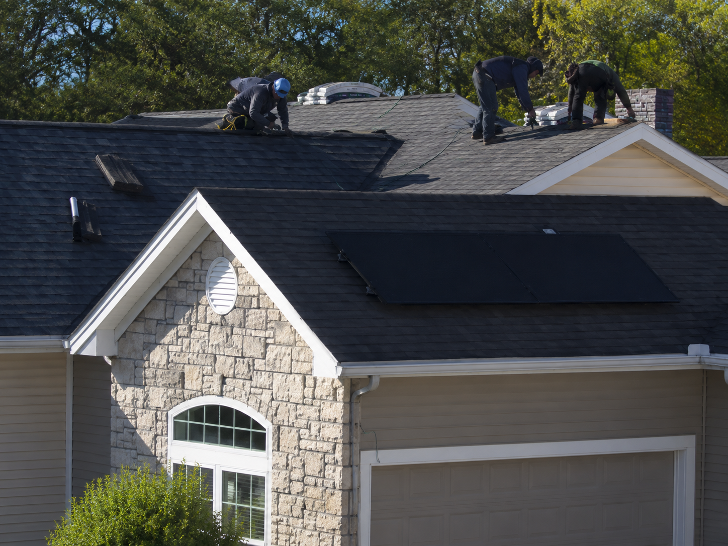 Roofing process with professionals at work